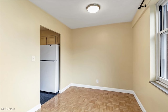 spare room featuring light parquet floors