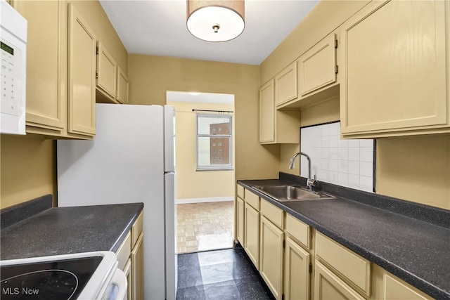 kitchen featuring tasteful backsplash, sink, and stove