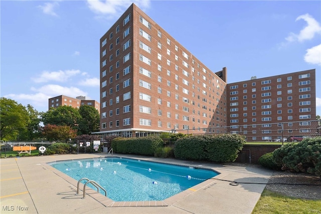 view of swimming pool with a patio area