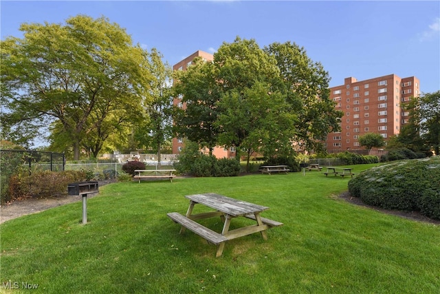 view of home's community featuring a lawn