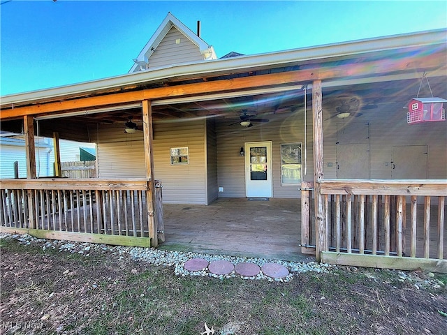 entrance to property with ceiling fan