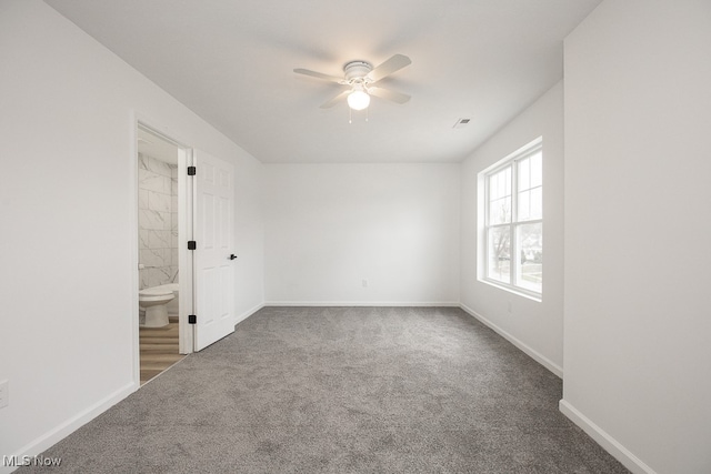 unfurnished room featuring carpet floors and ceiling fan