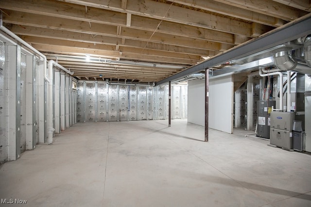 basement with heating unit and water heater