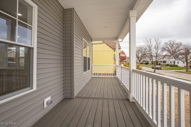 wooden terrace featuring a porch