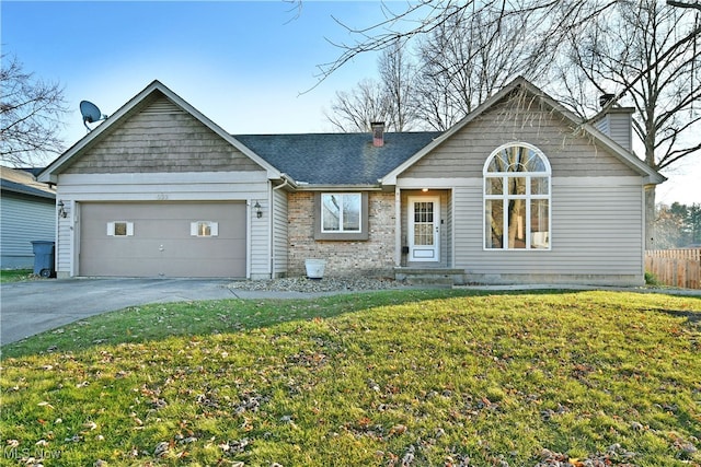 view of front of house featuring a front lawn and a garage