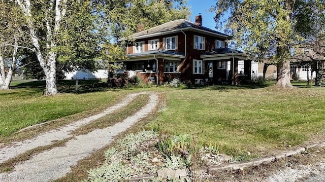 view of front of home featuring a front yard