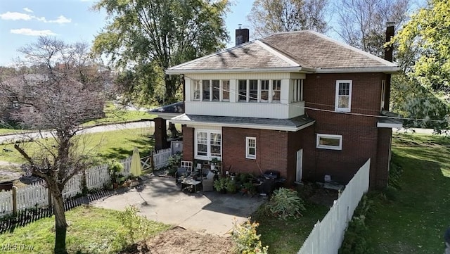 rear view of house with a lawn