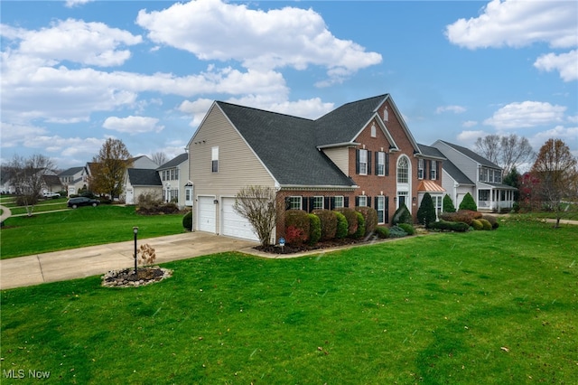 view of front of house featuring a front yard and a garage