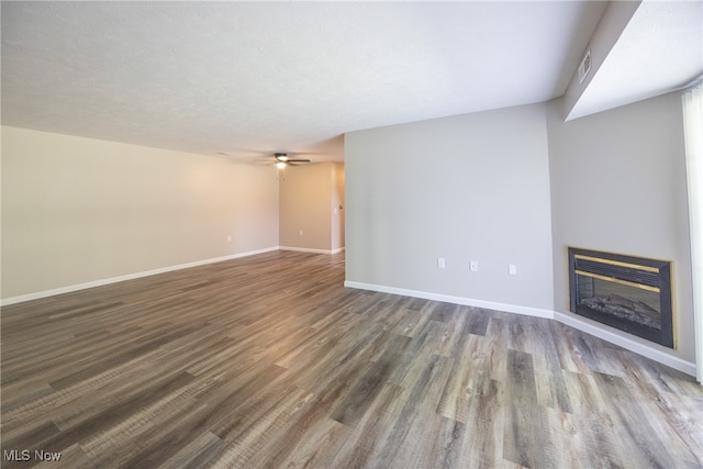 unfurnished living room with wood-type flooring