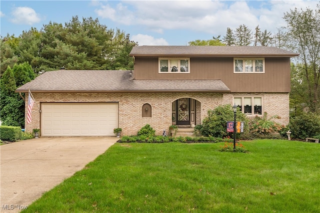 view of front facade featuring a front yard and a garage