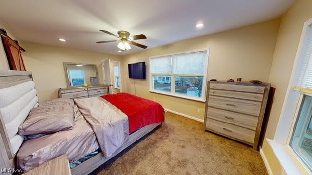 carpeted bedroom with ceiling fan