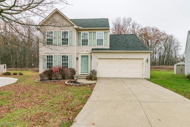 view of front of property featuring a garage and a front yard