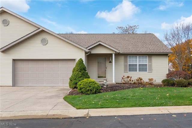 single story home with a front yard and a garage