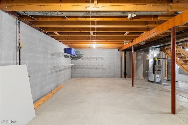 basement with gas water heater and heating unit