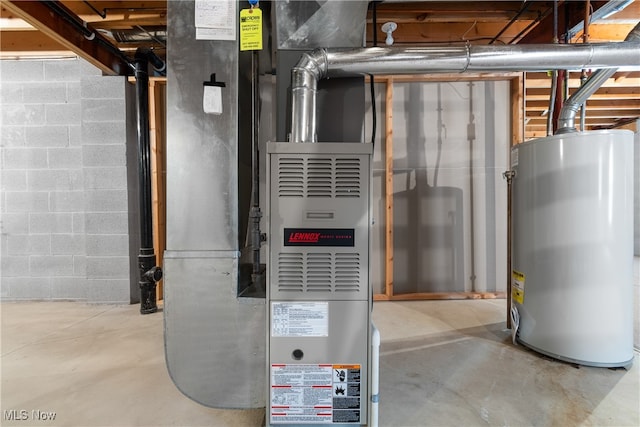 utility room featuring gas water heater and heating unit