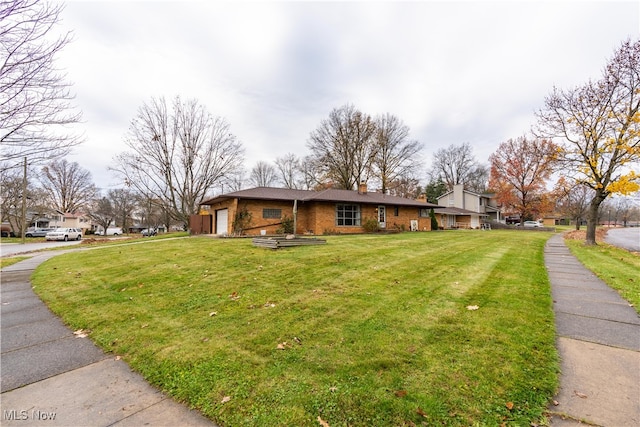 view of property exterior with a yard