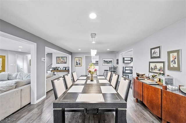 dining space with hardwood / wood-style floors