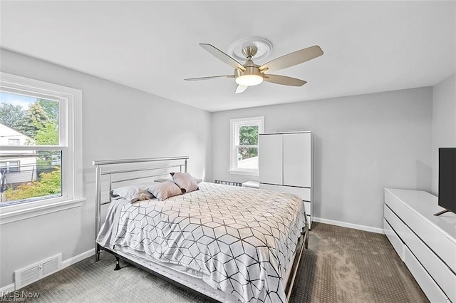 carpeted bedroom with ceiling fan