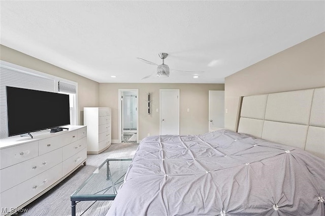 carpeted bedroom featuring connected bathroom and ceiling fan