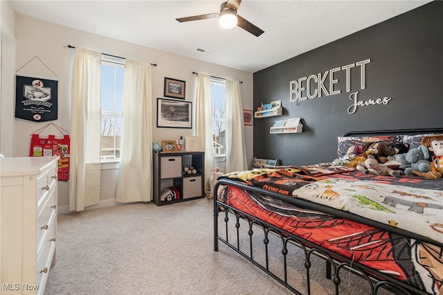 carpeted bedroom with ceiling fan