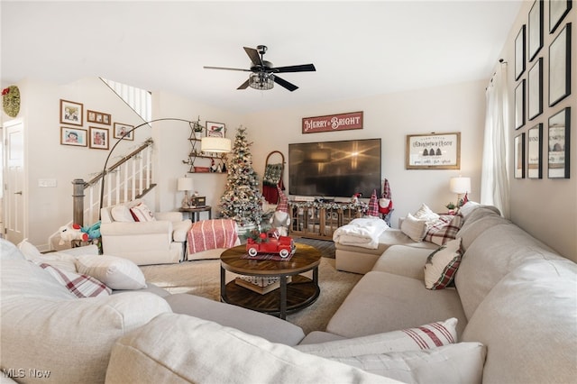 carpeted living room with a wealth of natural light and ceiling fan