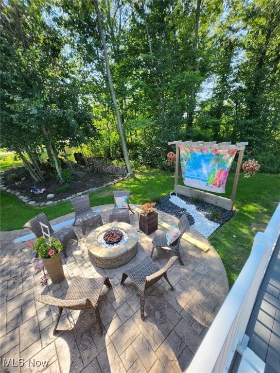 view of patio with a fire pit