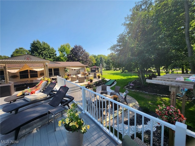 wooden deck with a yard and an outdoor living space