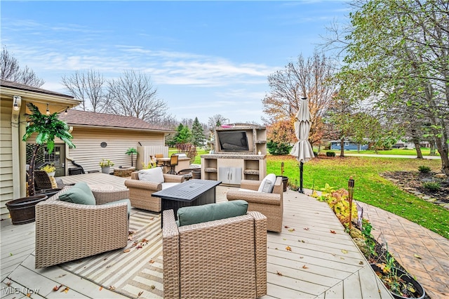 deck with an outdoor living space with a fireplace