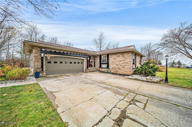 single story home with a garage and a front lawn