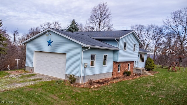 view of home's exterior with a yard and a garage