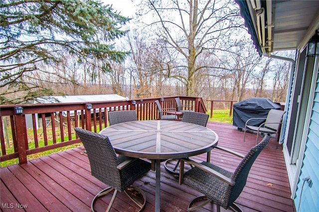 wooden deck featuring area for grilling