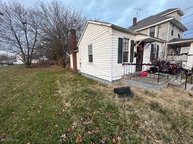 view of home's exterior featuring a lawn