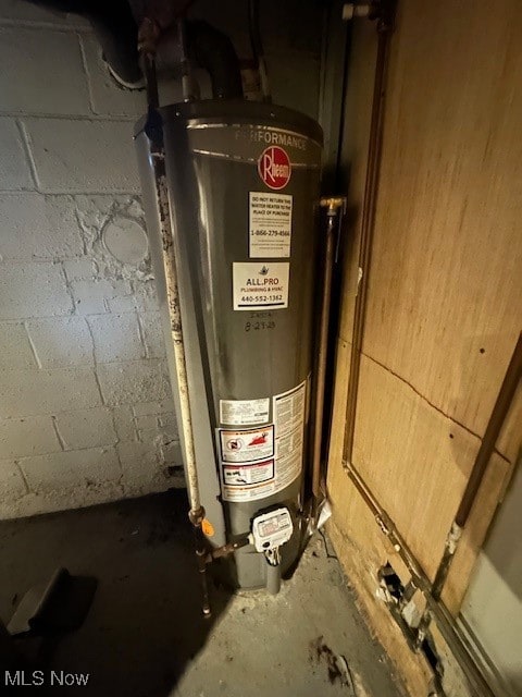 utility room featuring gas water heater