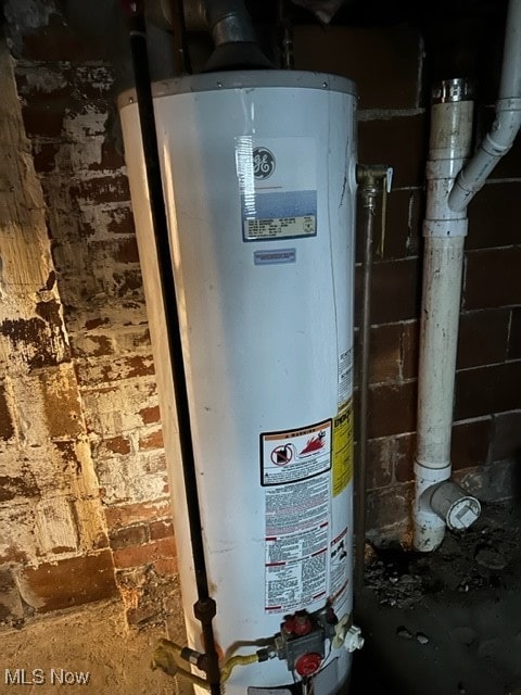 utility room with water heater