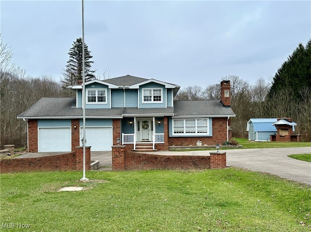 view of front property featuring a front yard and a garage