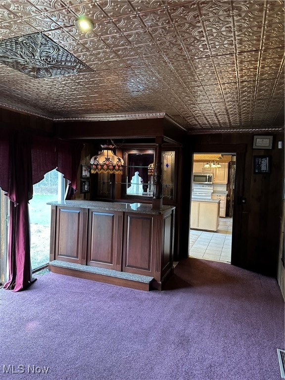 bar featuring light colored carpet