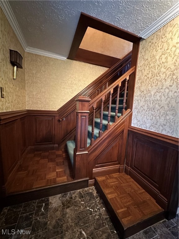 room details with a textured ceiling and ornamental molding