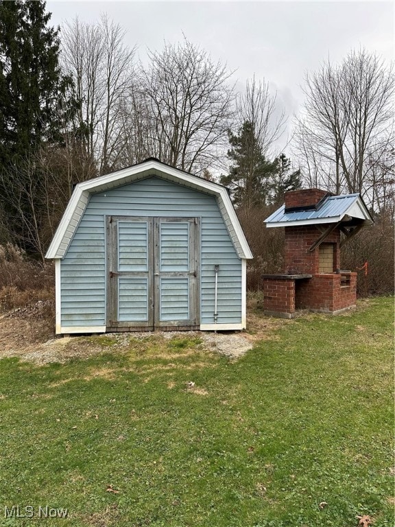 view of outbuilding with a lawn