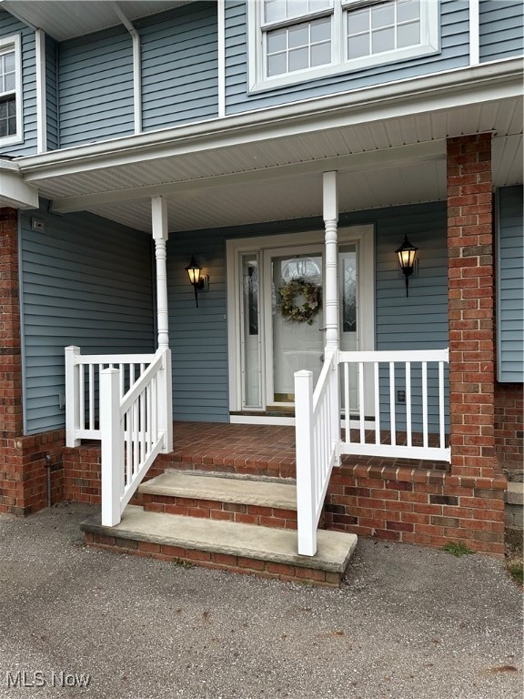 entrance to property with a porch