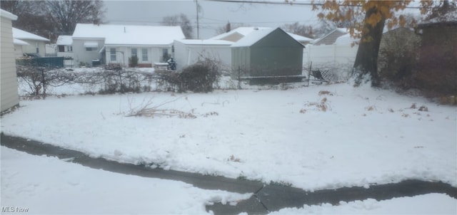 view of yard layered in snow