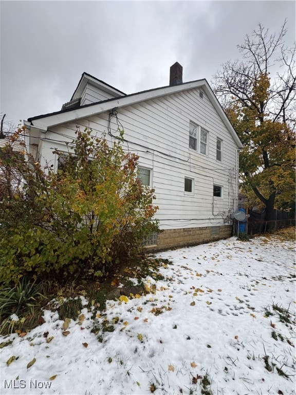 view of snow covered property