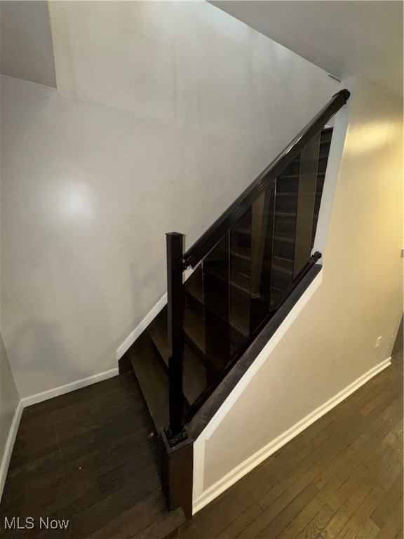 staircase featuring hardwood / wood-style floors