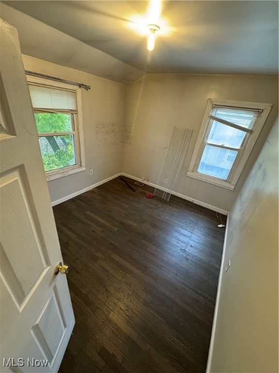 empty room with dark hardwood / wood-style floors