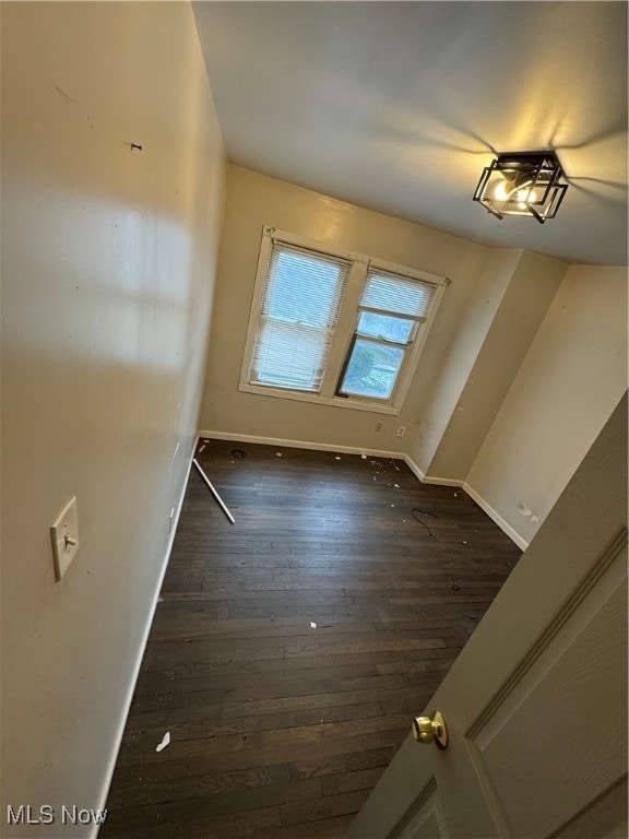 interior space with dark hardwood / wood-style floors