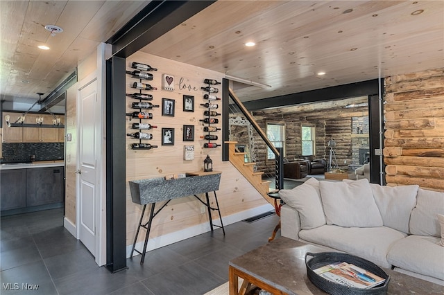 tiled living room featuring wood ceiling