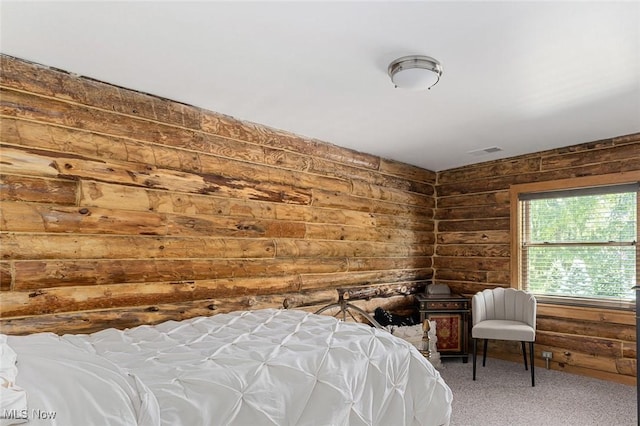 bedroom with carpet and wooden walls