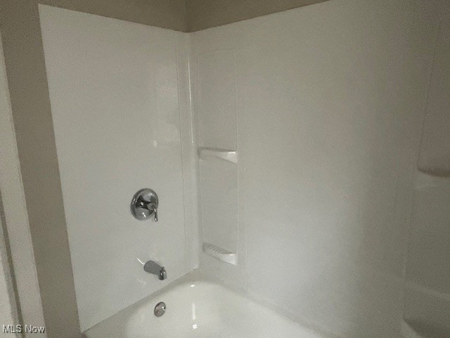 bathroom with shower / tub combination