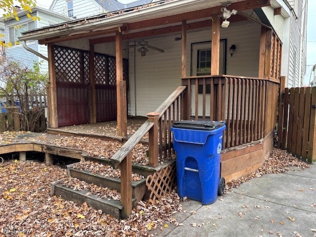 exterior space with ceiling fan