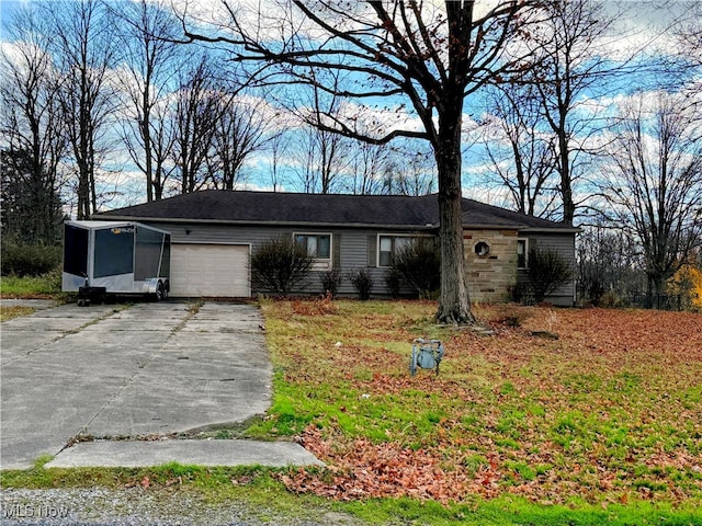 ranch-style house featuring a garage