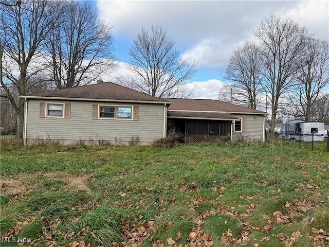 view of home's exterior featuring a sunroom